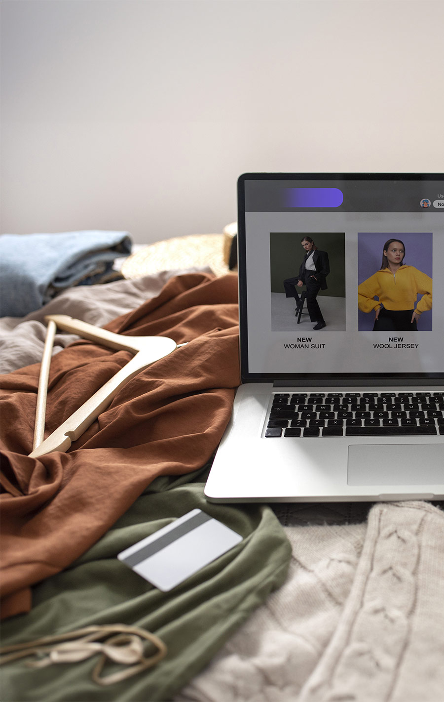 high-angle-clothes-bed-fast-fashion-concept